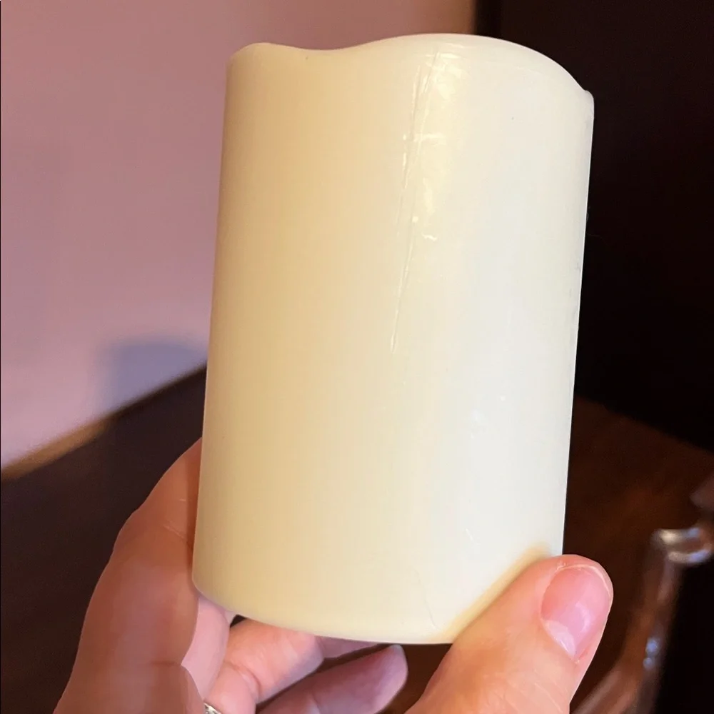 Four  candles — 4 inch cream color battery powered candles.